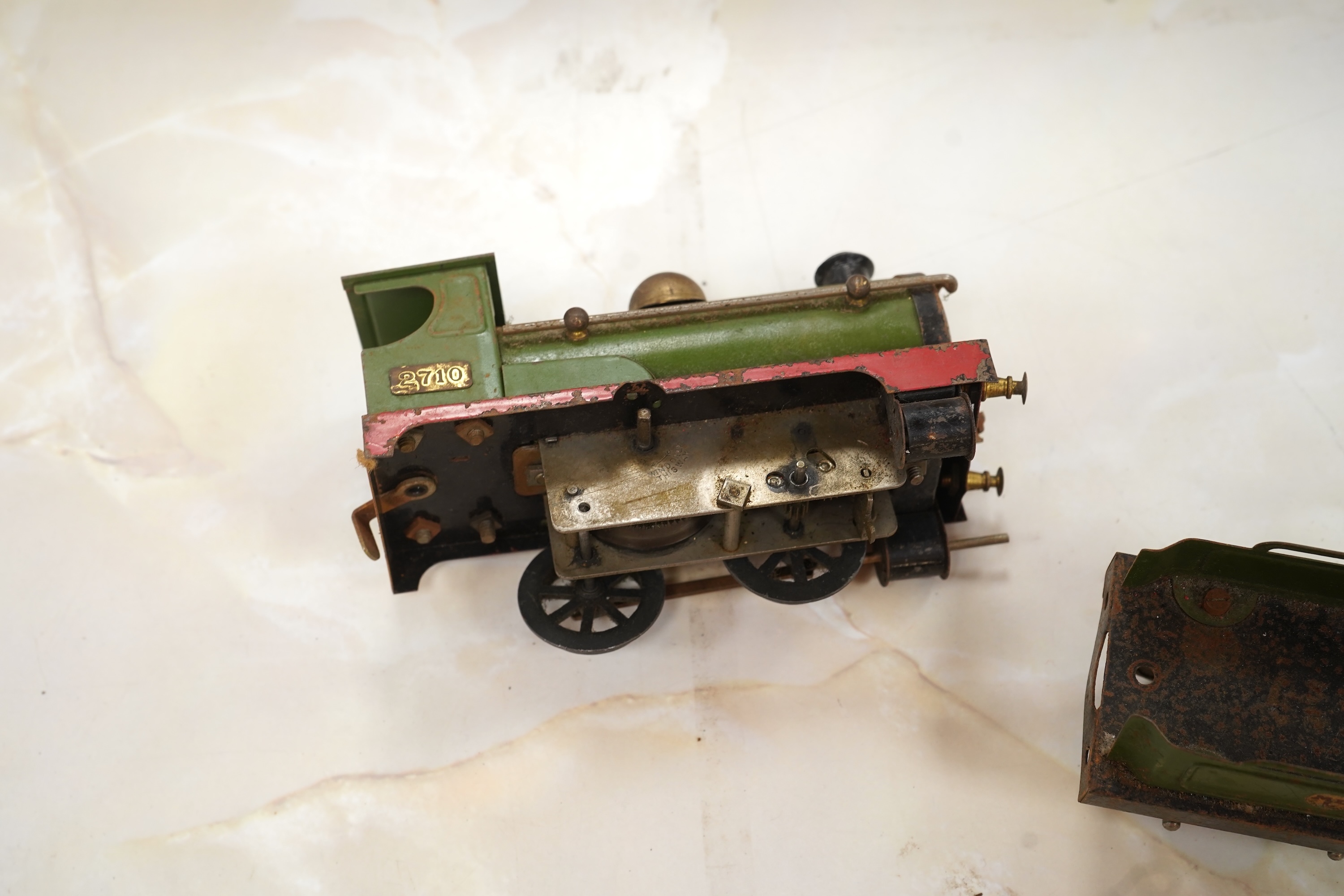 A Bing for Bassett Lowke 0 gauge tinplate clockwork LNER Ivatt 4-4-0 tender locomotive, 4390, together with an early Hornby clockwork 0-4-0, 2710, in GNR green livery with Meccano Ltd roundels to locomotive splasher and